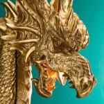 Wall Lamp Dragon Gold, shown mounted in a living room