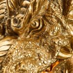 Wall Lamp Dragon Gold, shown mounted in a living room