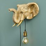 Wall Lamp Elephant Gold, shown mounted in a living room