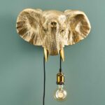 Wall Lamp Elephant Gold, shown mounted in a living room