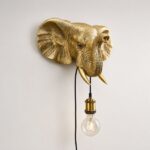 Wall Lamp Elephant Gold, illuminated view showing the visible bulb