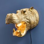 Wall Lamp Hippopotamus Gold, illuminated view showing the visible bulb