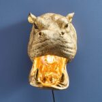 Wall Lamp Hippopotamus Gold, illuminated view showing the visible bulb