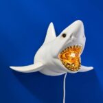 Wall Lamp Shark White, shown mounted in a living room