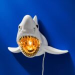 Wall Lamp Shark White, shown mounted in a living room
