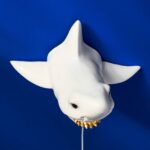 Wall Lamp Shark White, shown mounted in a living room