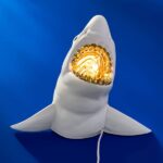 Wall Lamp Shark White, shown mounted in a living room