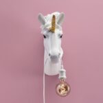 Wall Lamp Unicorn White, illuminated view showing the visible bulb