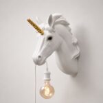 Wall Lamp Unicorn White, illuminated view showing the visible bulb