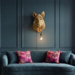 : Wall Lamp Wild Boar Gold, shown mounted in a living room