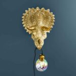 Wall Lamp Triceratops Gold, illuminated view