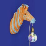 Wall Lamp Zebra Blue and Orange, shown mounted in a hallway setting