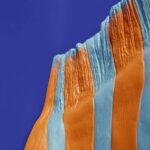 Wall Lamp Zebra Blue and Orange, illuminated view showing the visible bulb