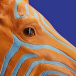 Wall Lamp Zebra Blue and Orange, close-up detail of the hand-painted finish