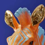 Wall Lamp Zebra Blue and Orange, illuminated view showing the visible bulb