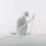 : Table Lamp Monkey Sitting White, illuminated view