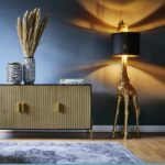 Floor Lamp Giraffe Gold and Black, shown in a living room setting