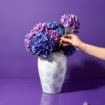 Porcelain lidded jar vase styled on a console