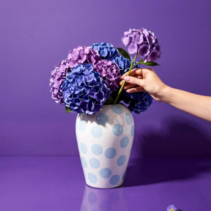 Porcelain lidded jar vase styled on a console